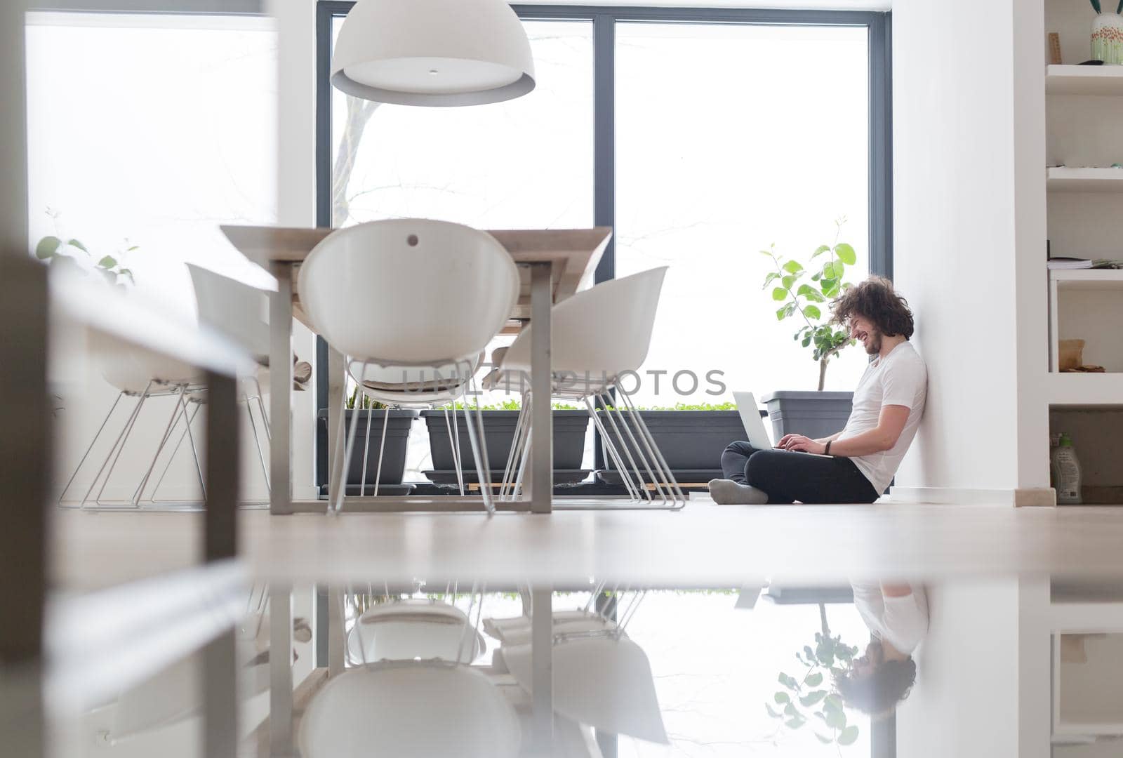 Real man Using laptop on the floor At Home  Enjoying Relaxing