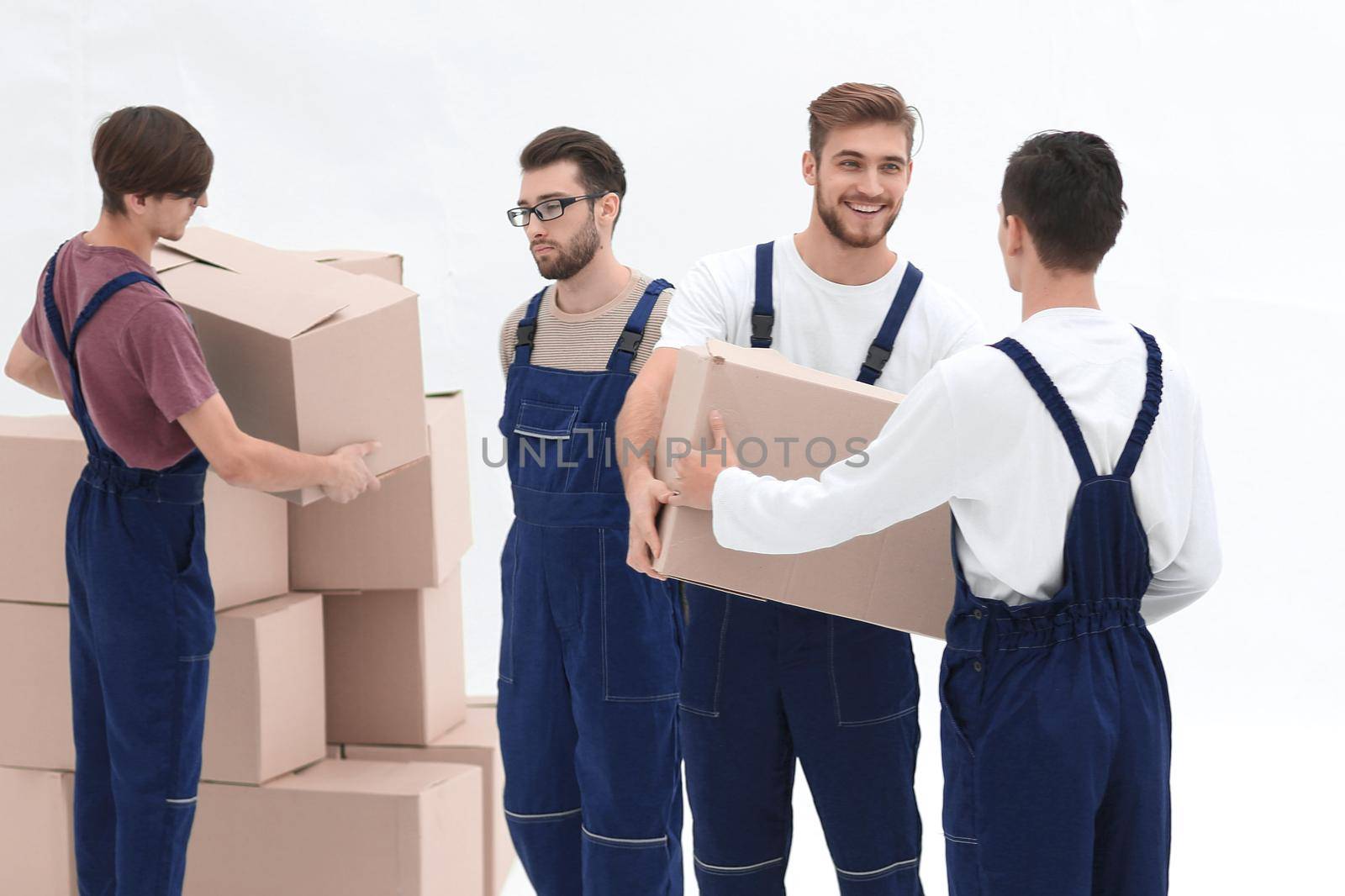 Movers lifting stack of cardboard moving boxes isolated on white by asdf