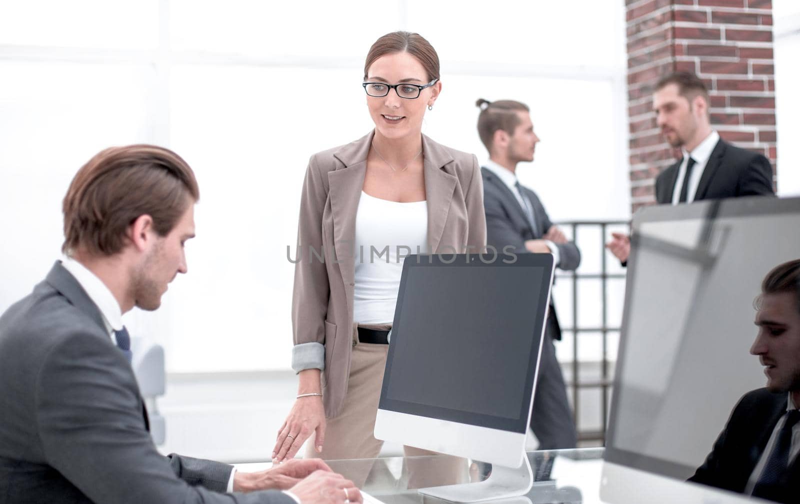 woman Manager standing near the Desk.office weekdays