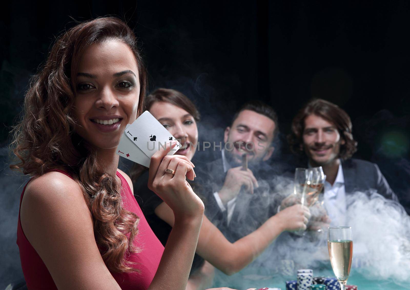 adult group celebrating friend winning blackjack by asdf
