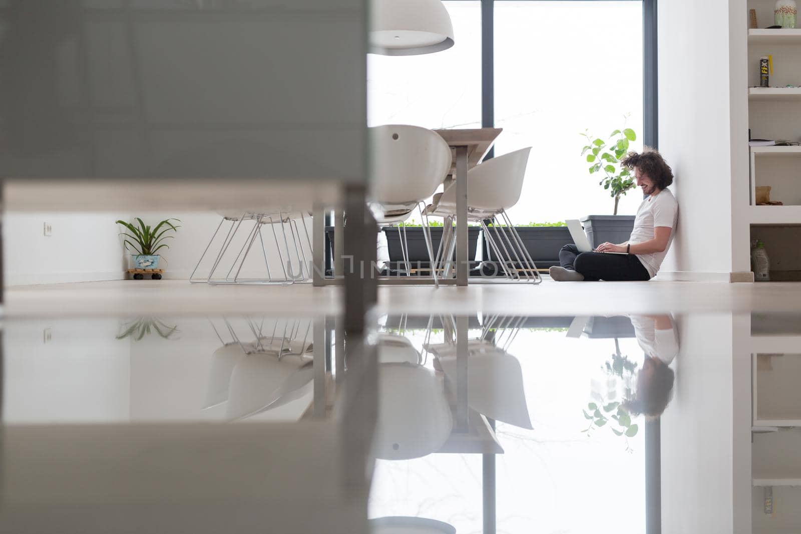 Real man Using laptop on the floor At Home  Enjoying Relaxing