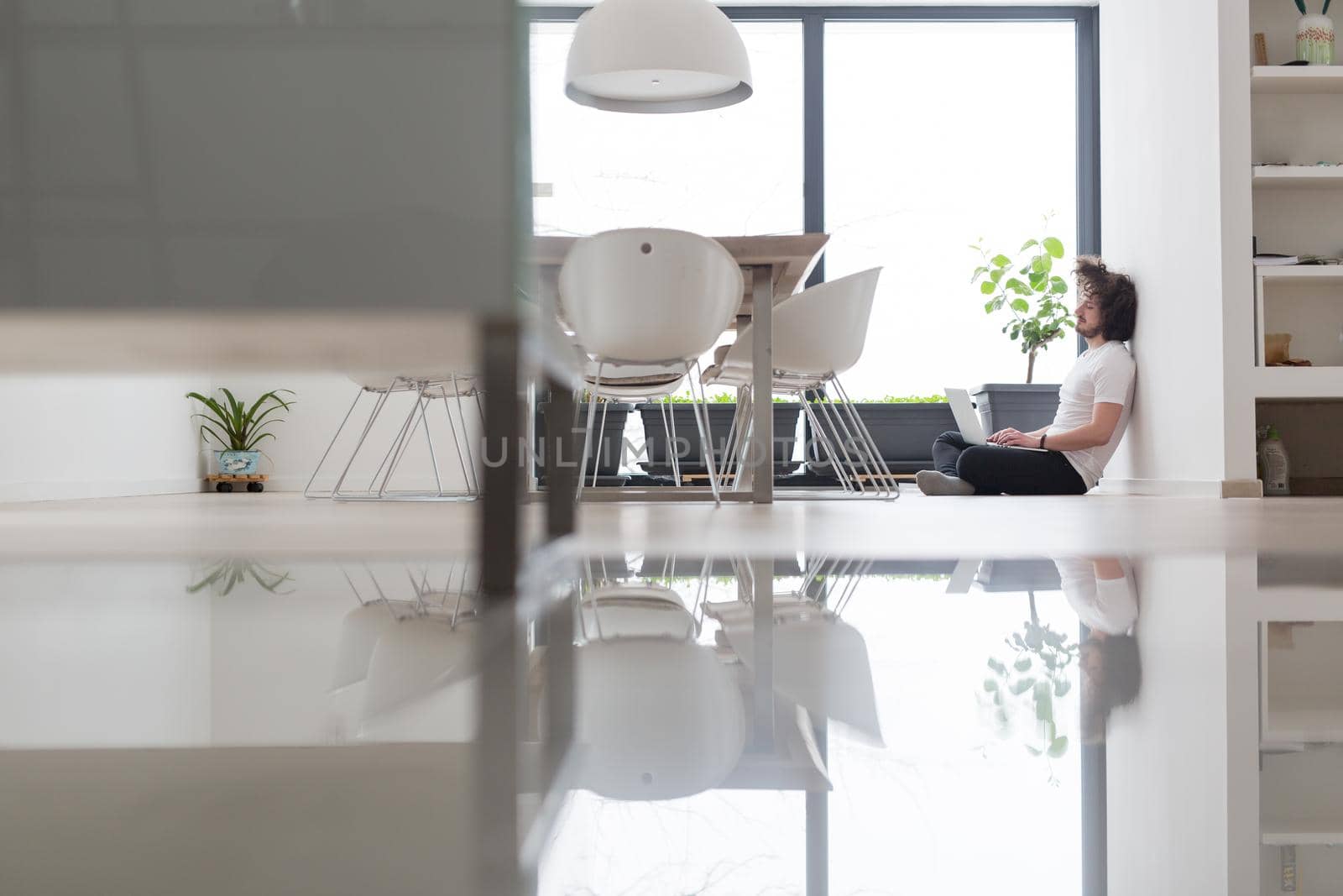 Real man Using laptop on the floor At Home  Enjoying Relaxing