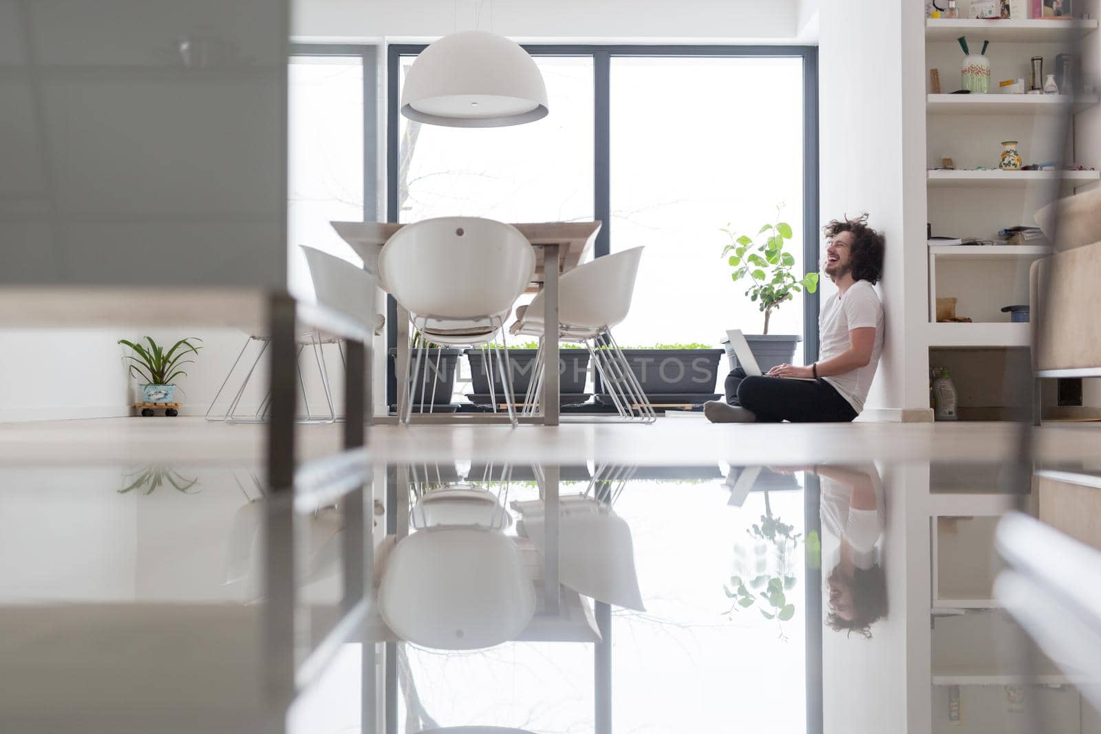 Real man Using laptop on the floor At Home  Enjoying Relaxing