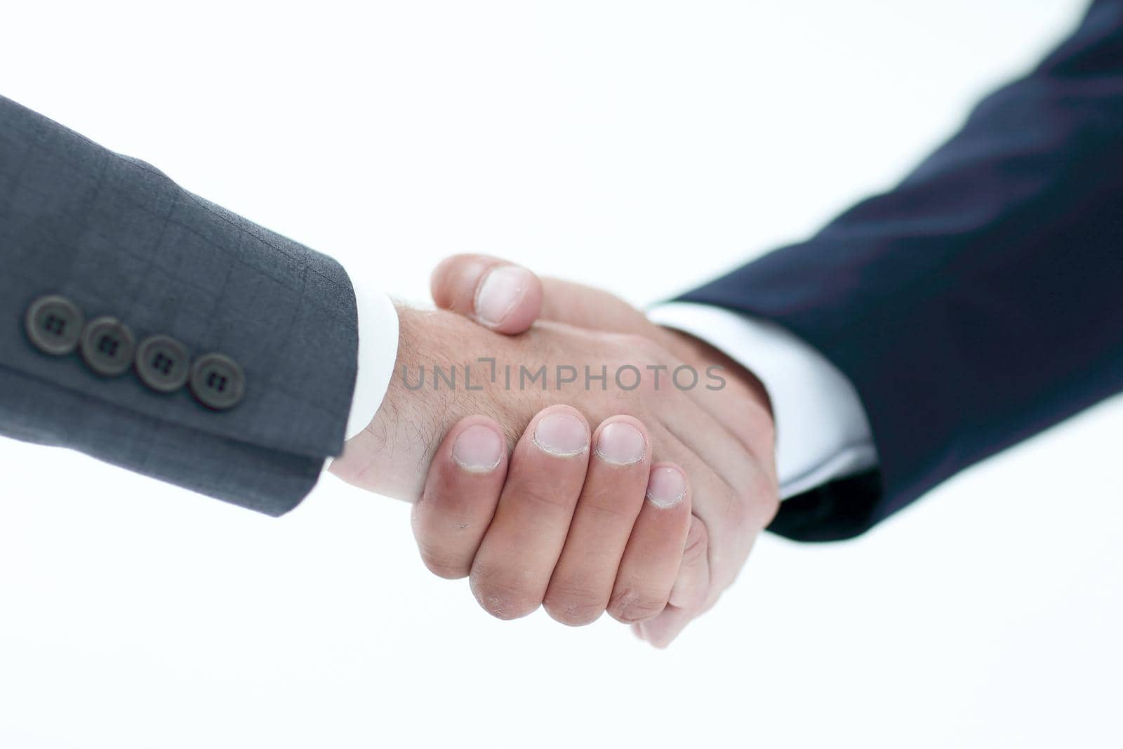 Business handshake - closing a deal on a gray background