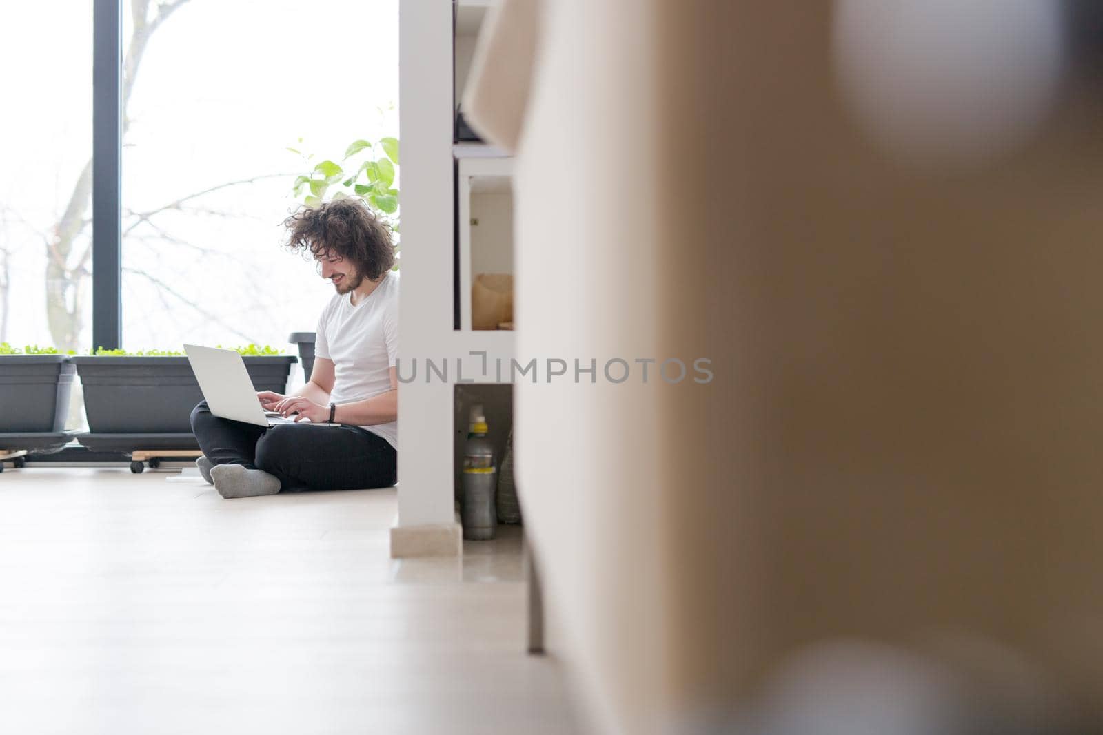 Real man Using laptop on the floor At Home  Enjoying Relaxing