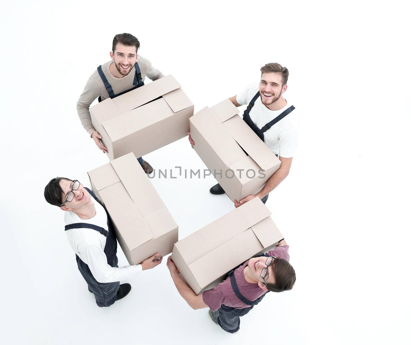 Movers lifting stack of cardboard moving boxes isolated on white