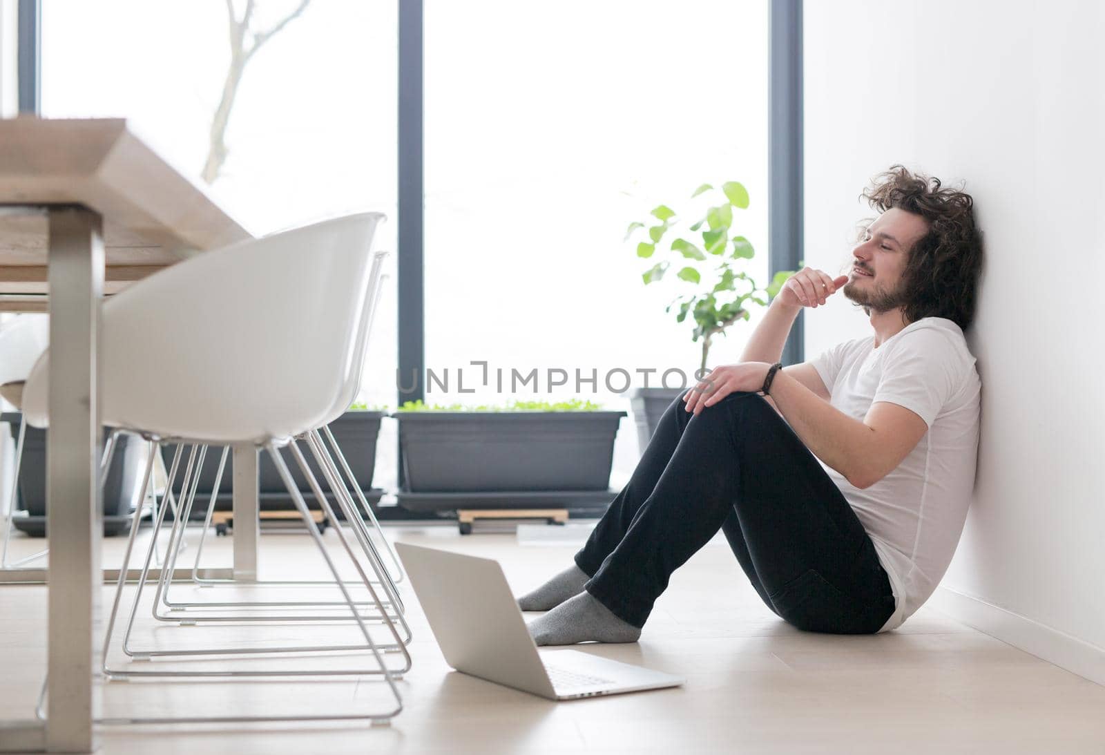 Real man Using laptop on the floor At Home  Enjoying Relaxing