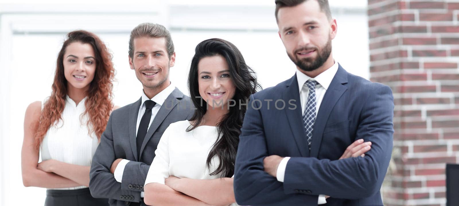 group of smiling business people by asdf