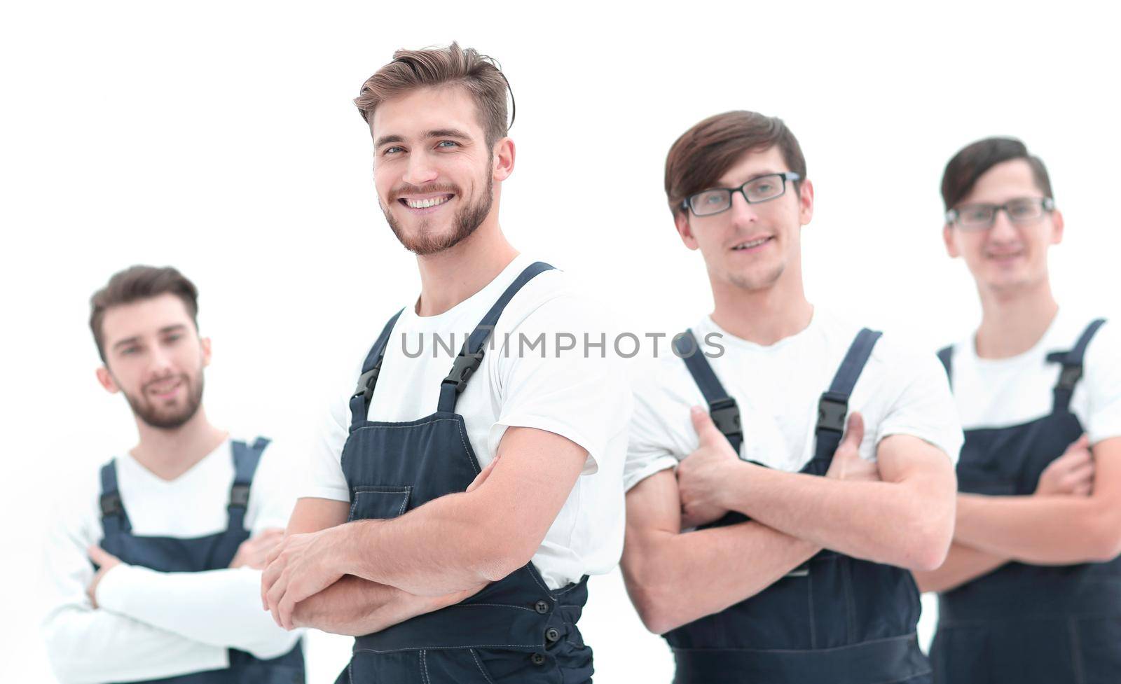 Cheerful team of responsible movers isolated on white background.