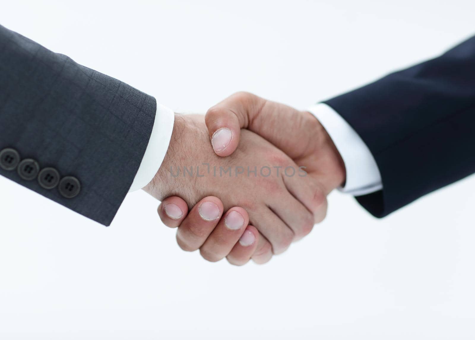Closeup of business people shaking hands over a deal by asdf