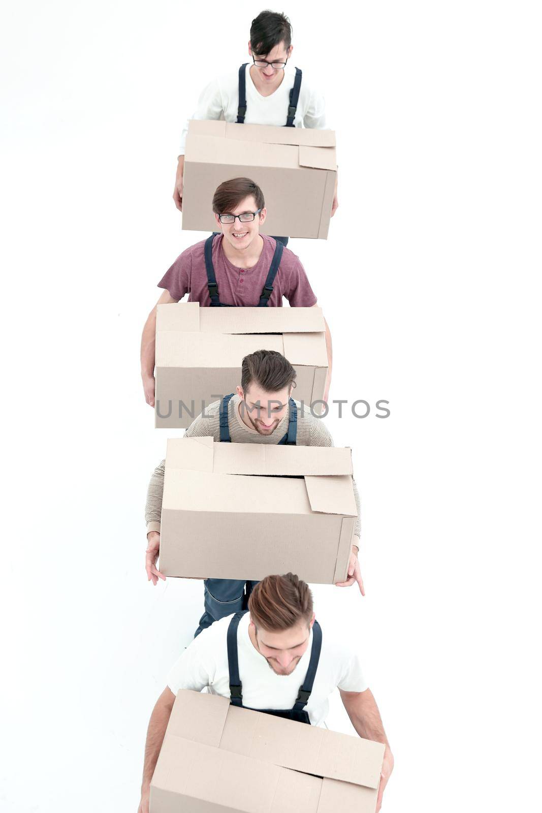 Young movers holding boxes standing in a row, isolated on white by asdf