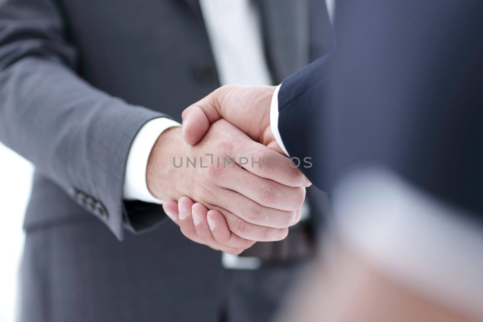 Close-up view of the hands of a businessman in the office in the formal wear.