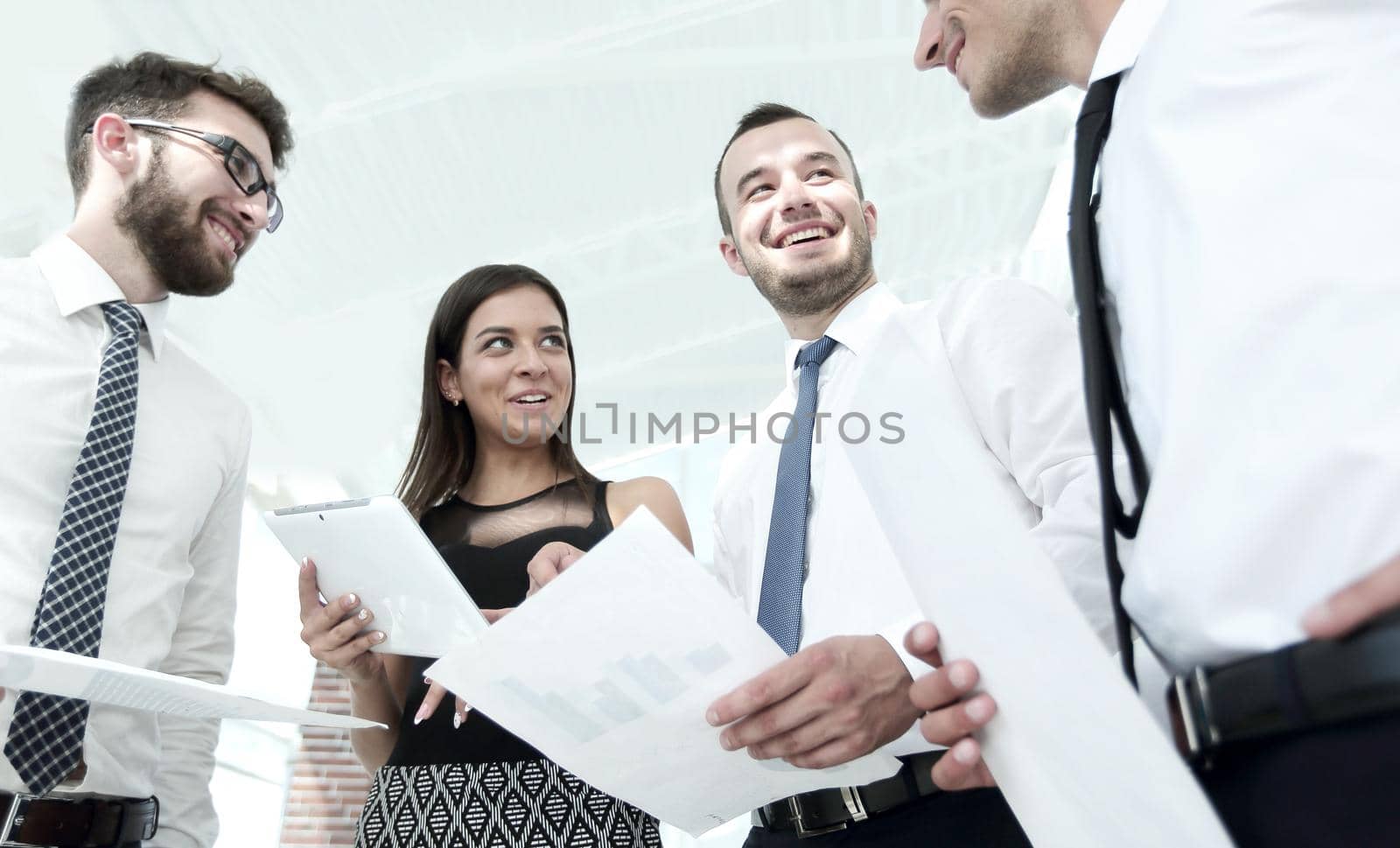 closeup of business team looking at the working papers by asdf