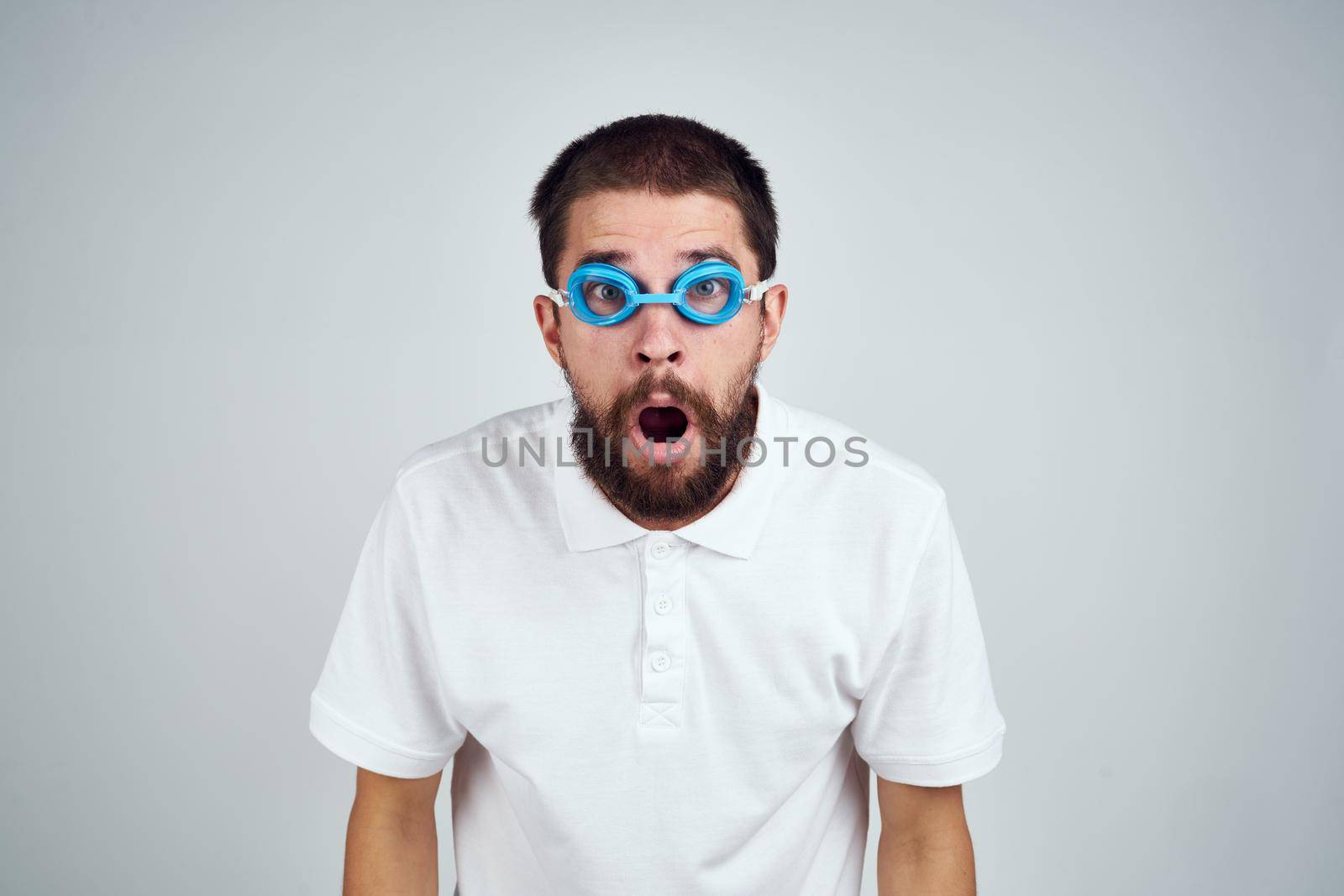 man wearing goggles for swimming emotions fun close-up. High quality photo
