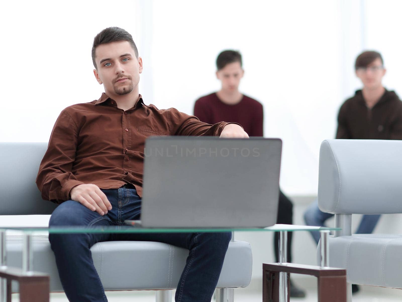 closeup.brooding guy with a laptop.photo with copy space