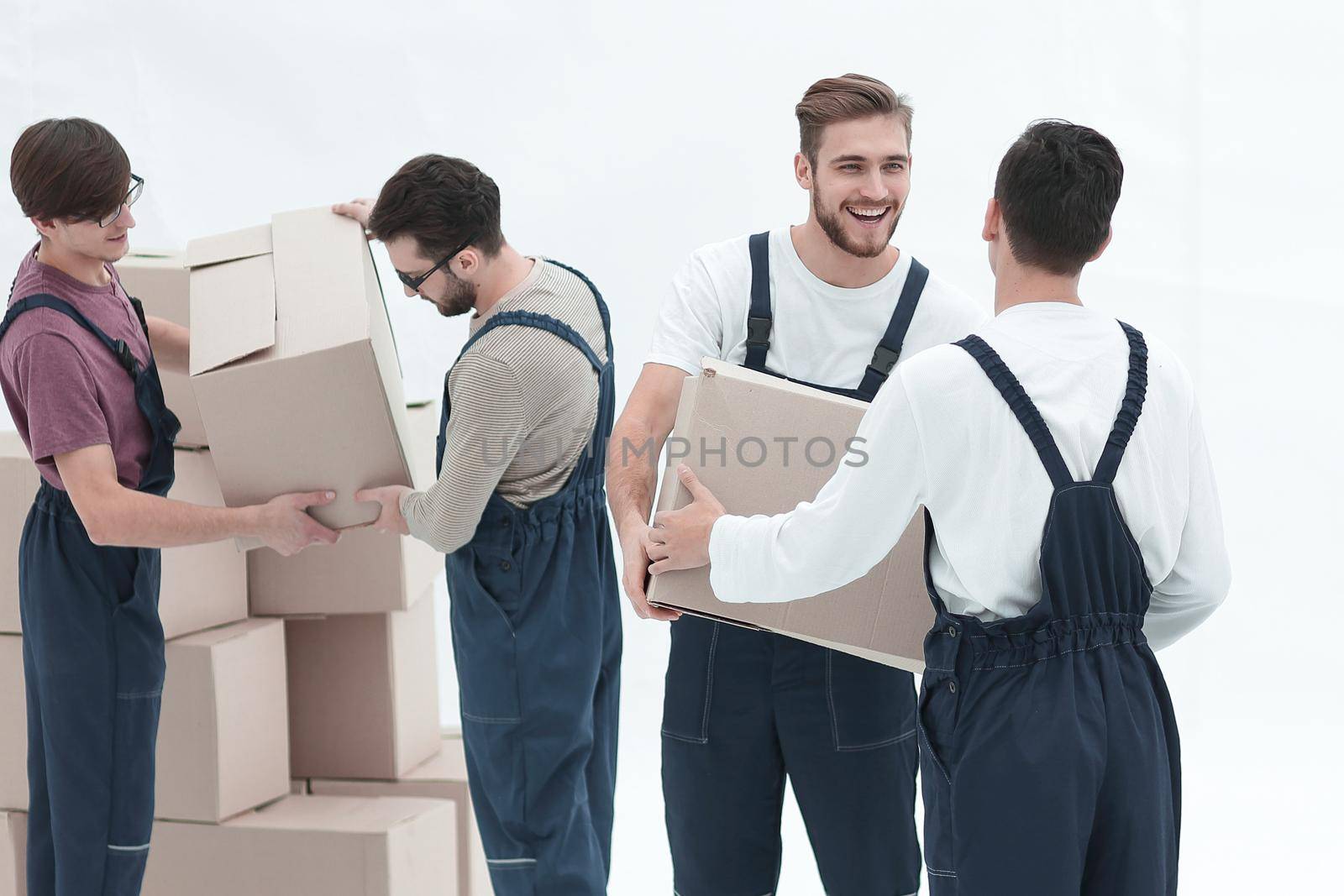 Movers lifting stack of cardboard moving boxes isolated on white by asdf