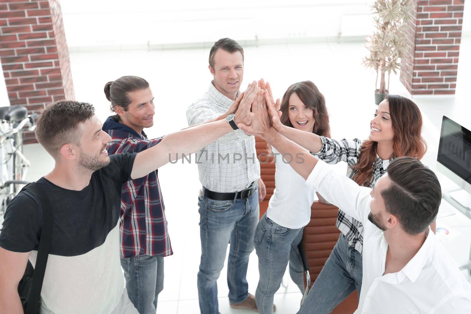 design team giving each other a high five.the concept of teamwork