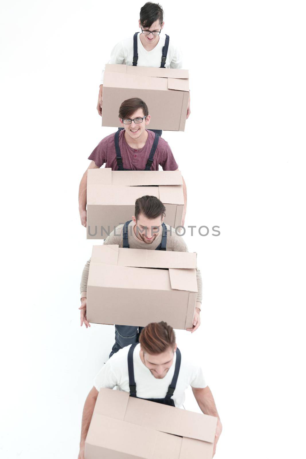 Young movers holding boxes standing in a row, isolated on white by asdf