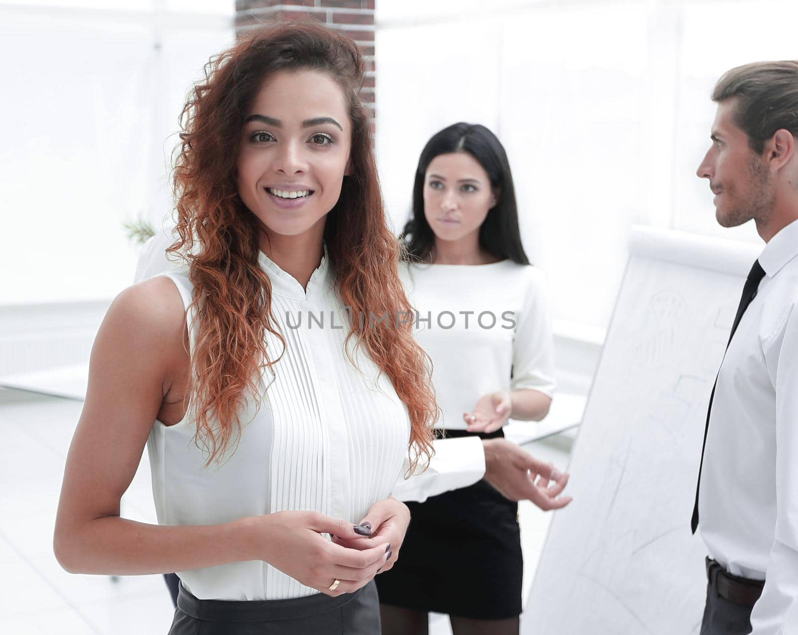 Executive business woman on the background of colleagues.