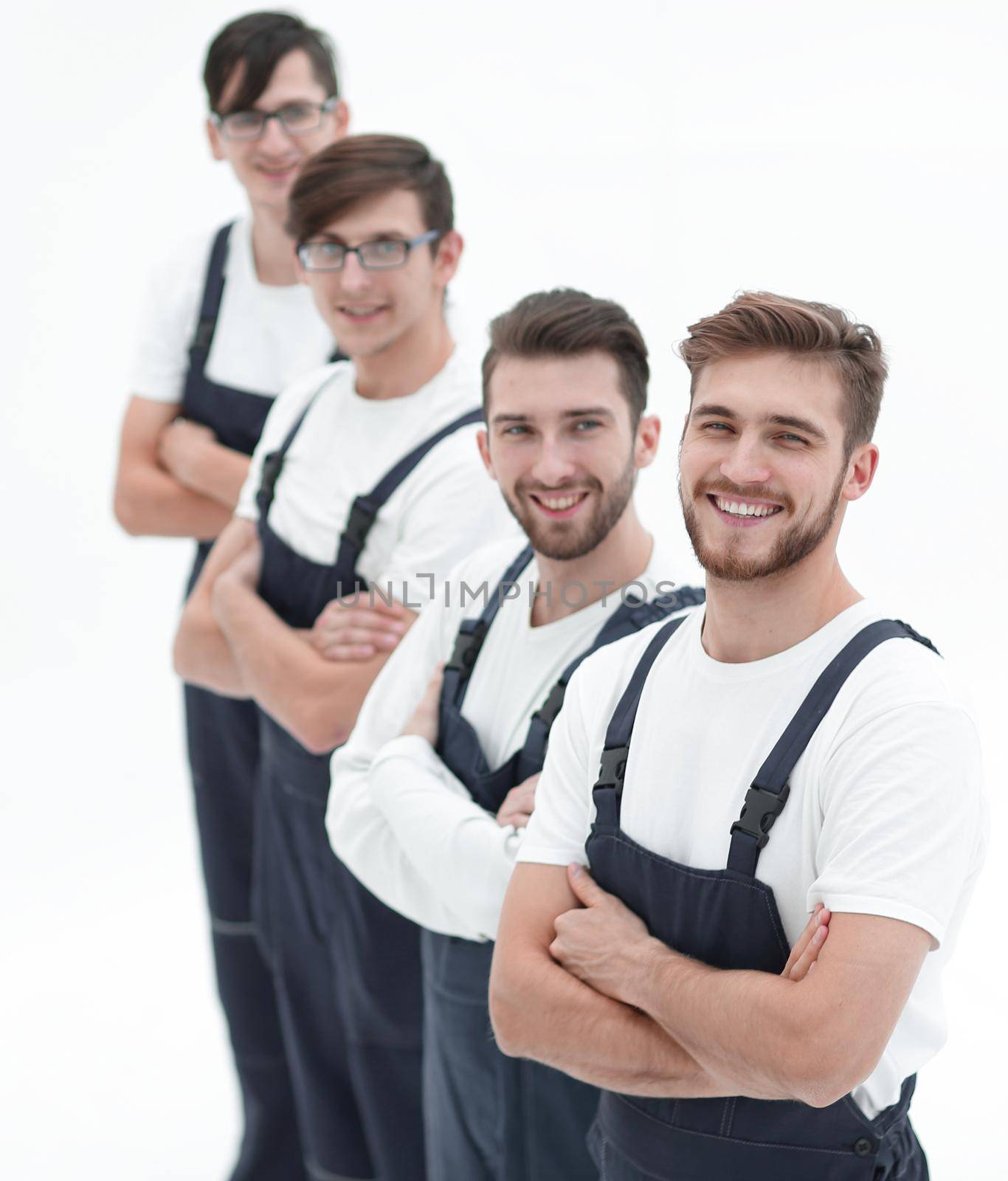 Cheerful team of responsible movers isolated on white background by asdf