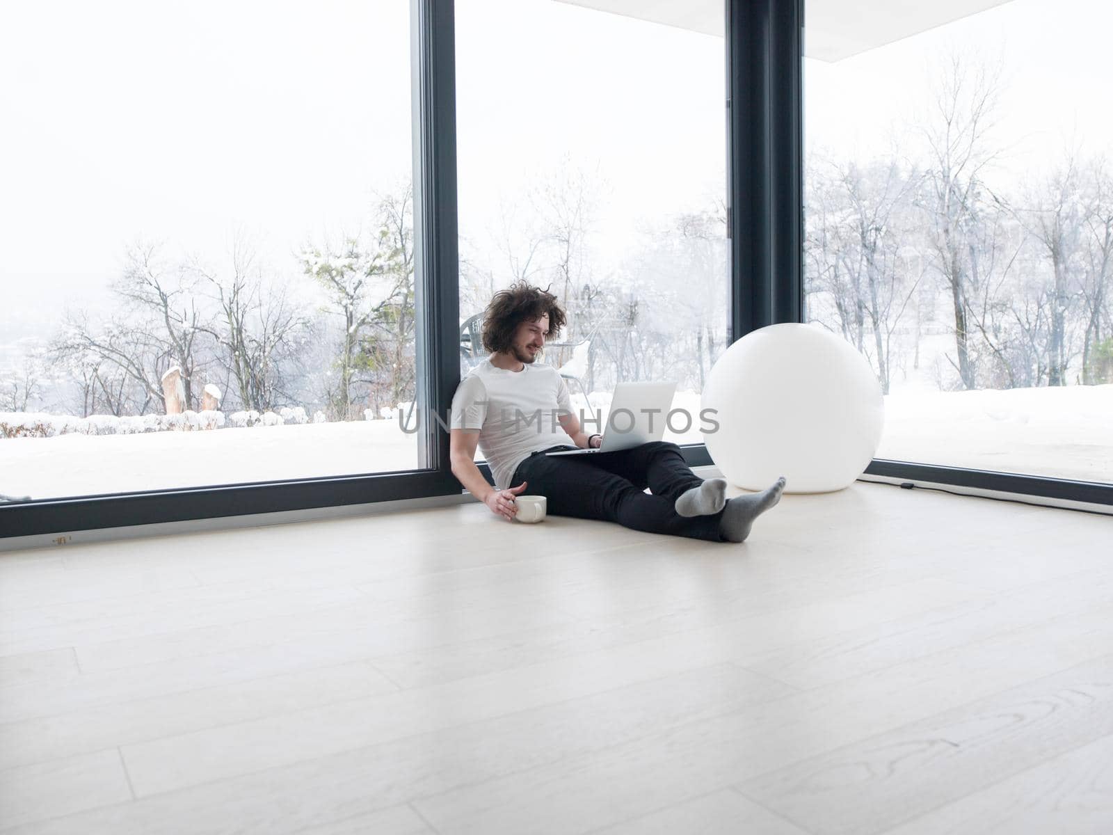 Real man Using laptop on the floor At Home  Enjoying Relaxing