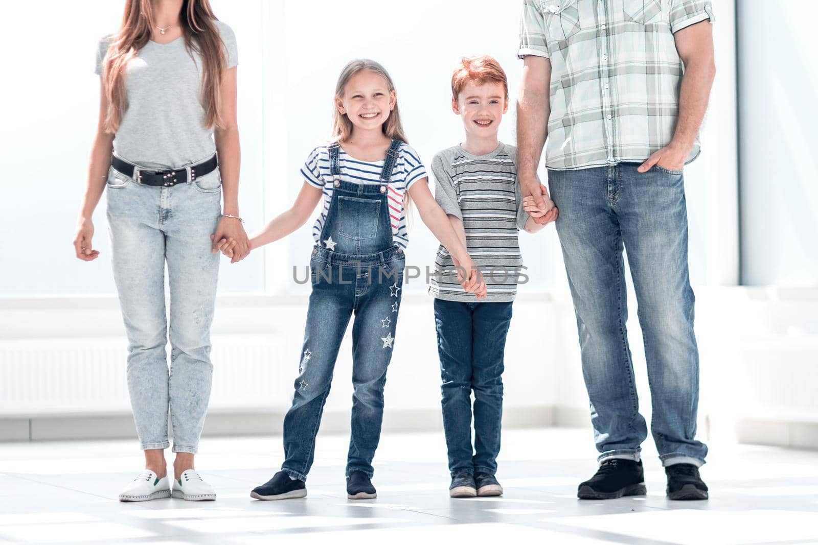 modern family standing in a new apartment.photo with copy space