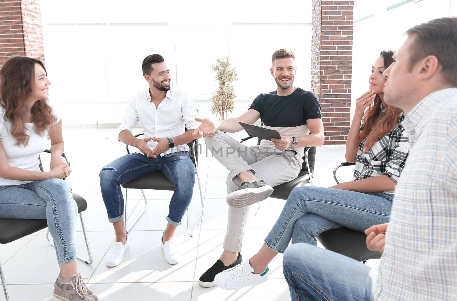 business team discussing ideas sitting in the lobby of the office.photo with copy space