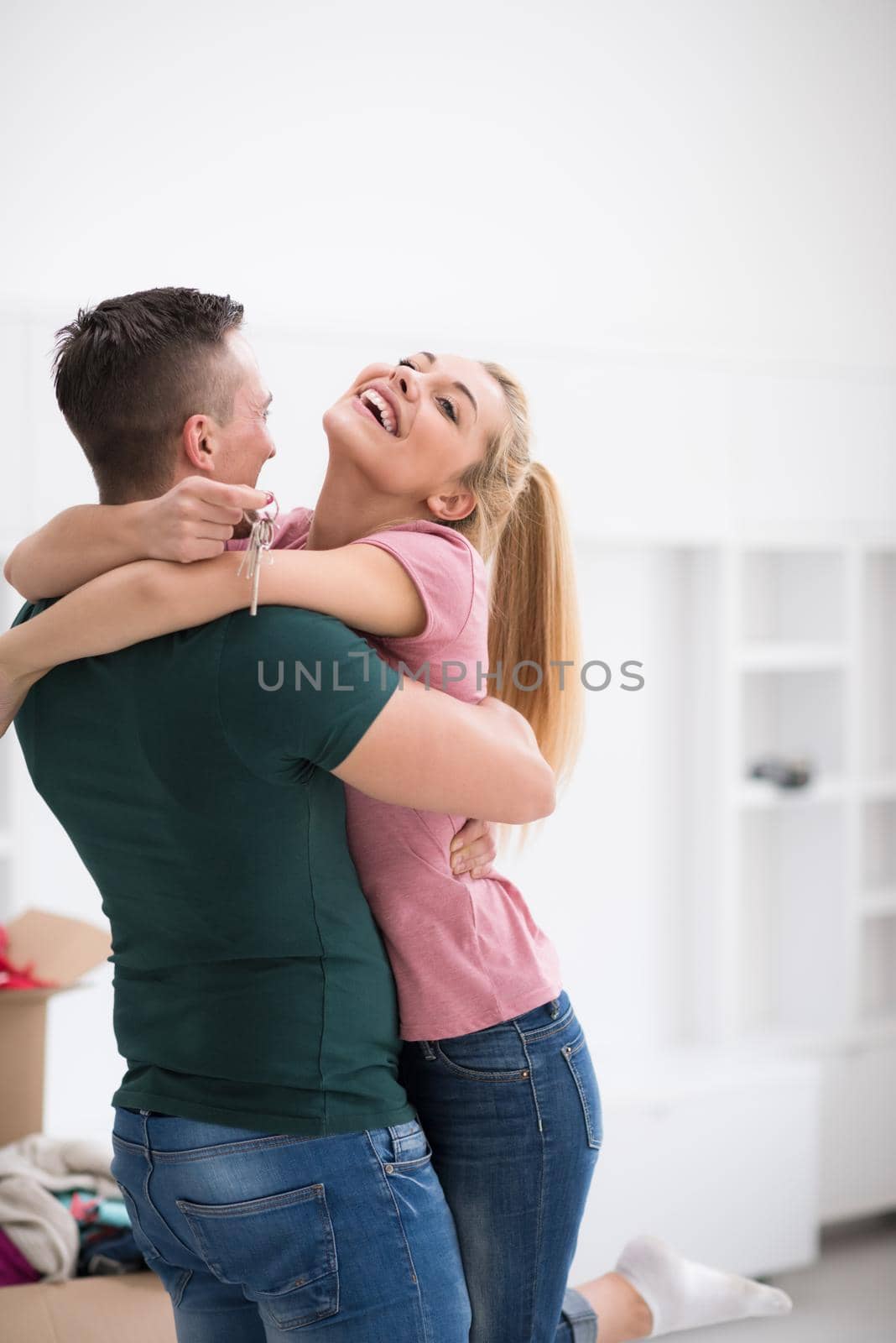 happy Young couple moving in new house by dotshock