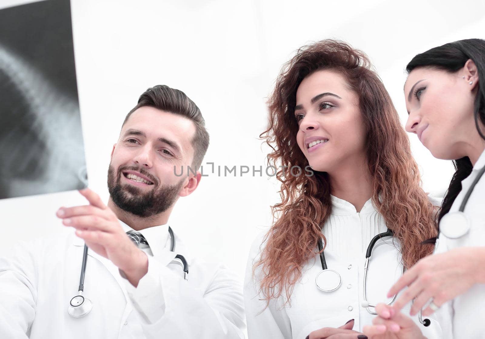 group of medical workers looking at patient's x-ray film.photo on white background