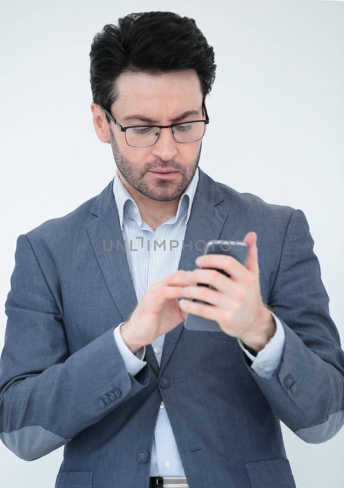 close up. business man reading an SMS on his smartphone.people and technology