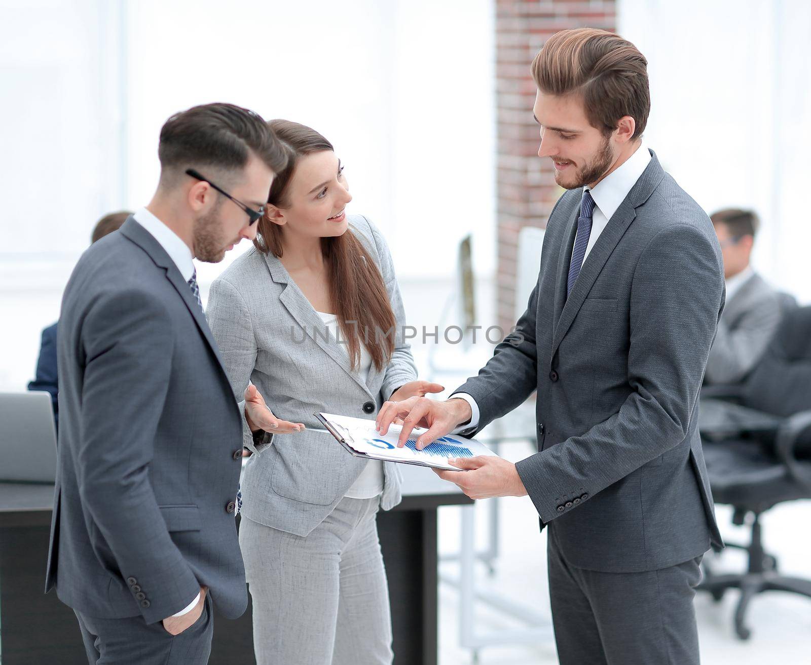 Business woman showing diagram and explaining information to entrepreneur