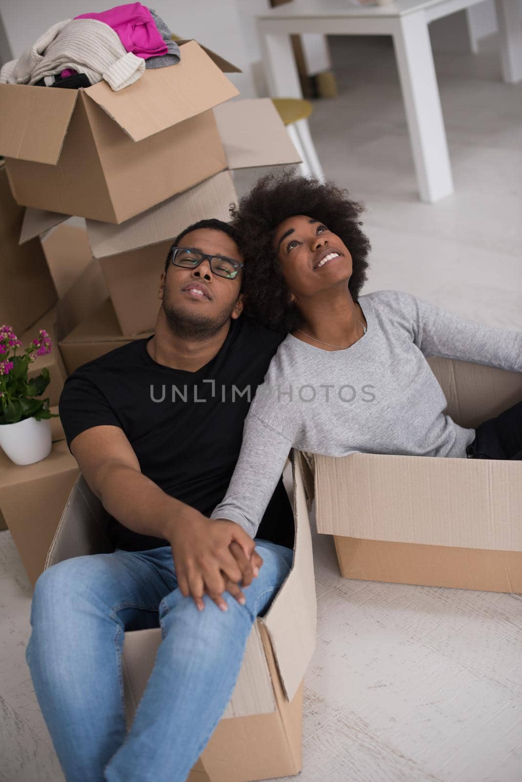 African American couple  playing with packing material by dotshock