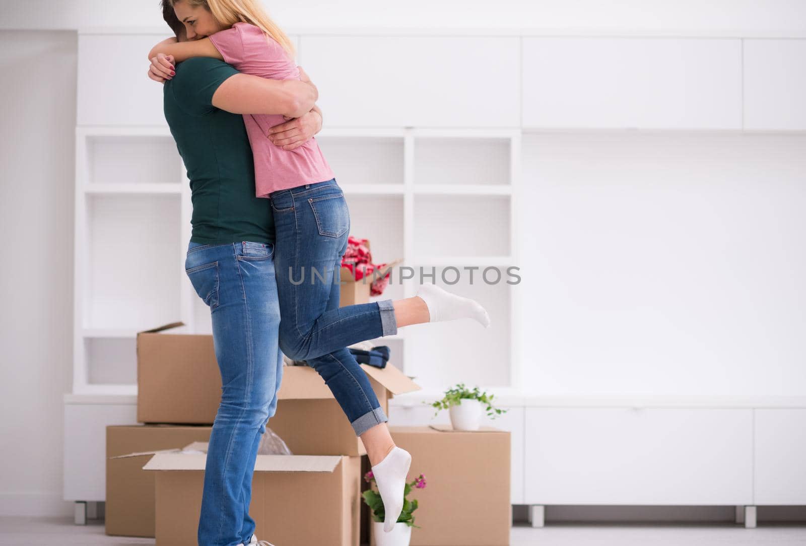 excited happy young couple looking forward to moving into a new home