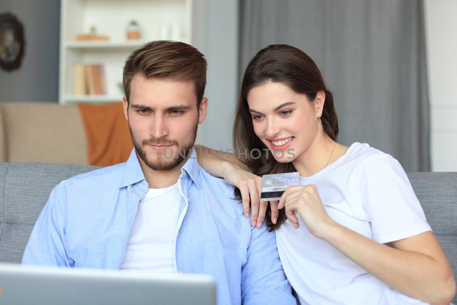Young couple doing some online shopping at home