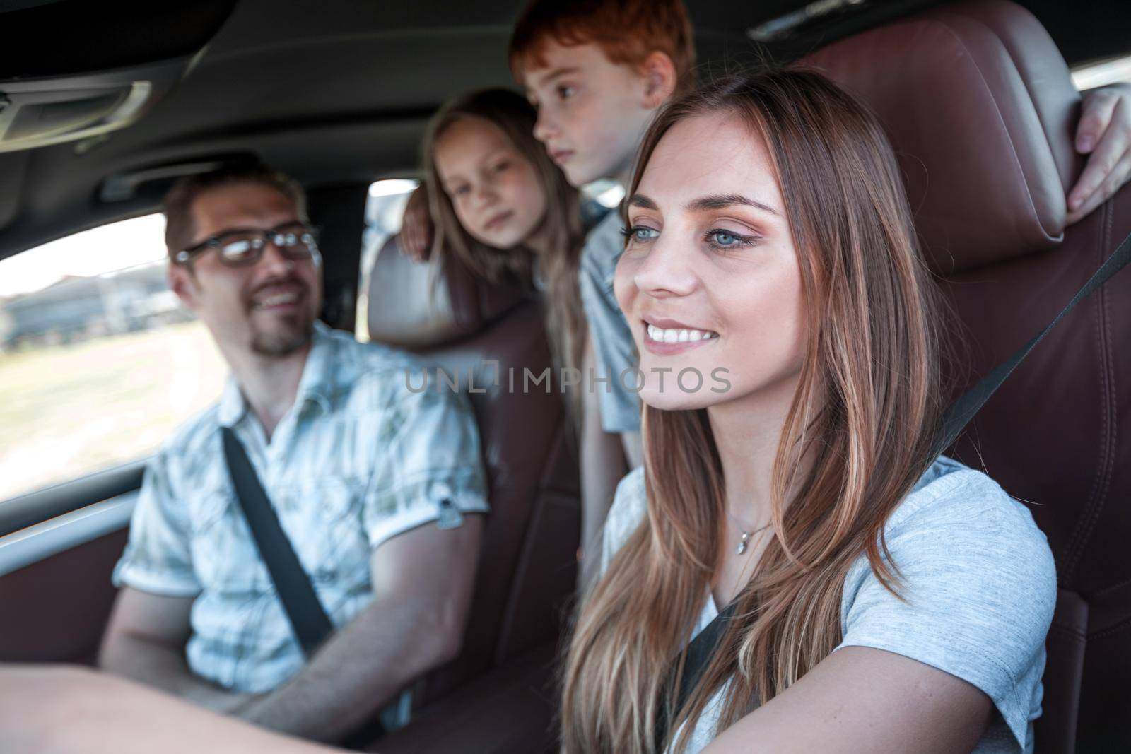 close up. the young woman behind the wheel of the family car.family holiday concept