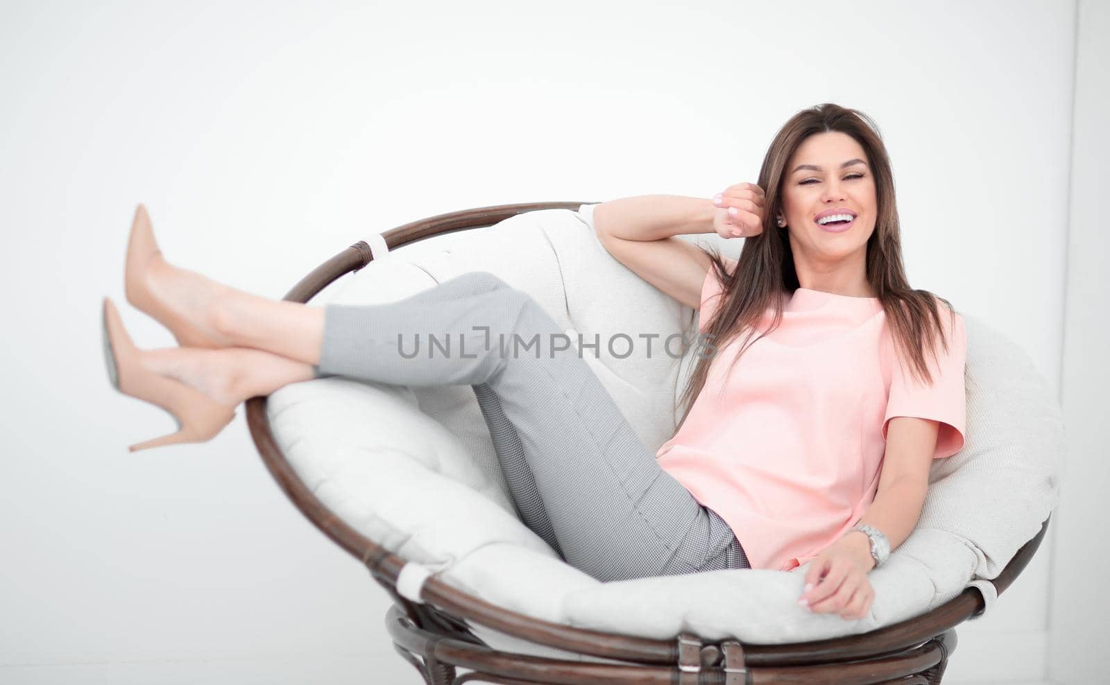 beautiful young woman sitting in comfortable chair.photo with copy space