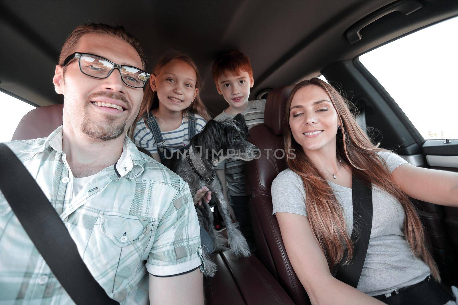 close up. happy family in a comfortable car by asdf