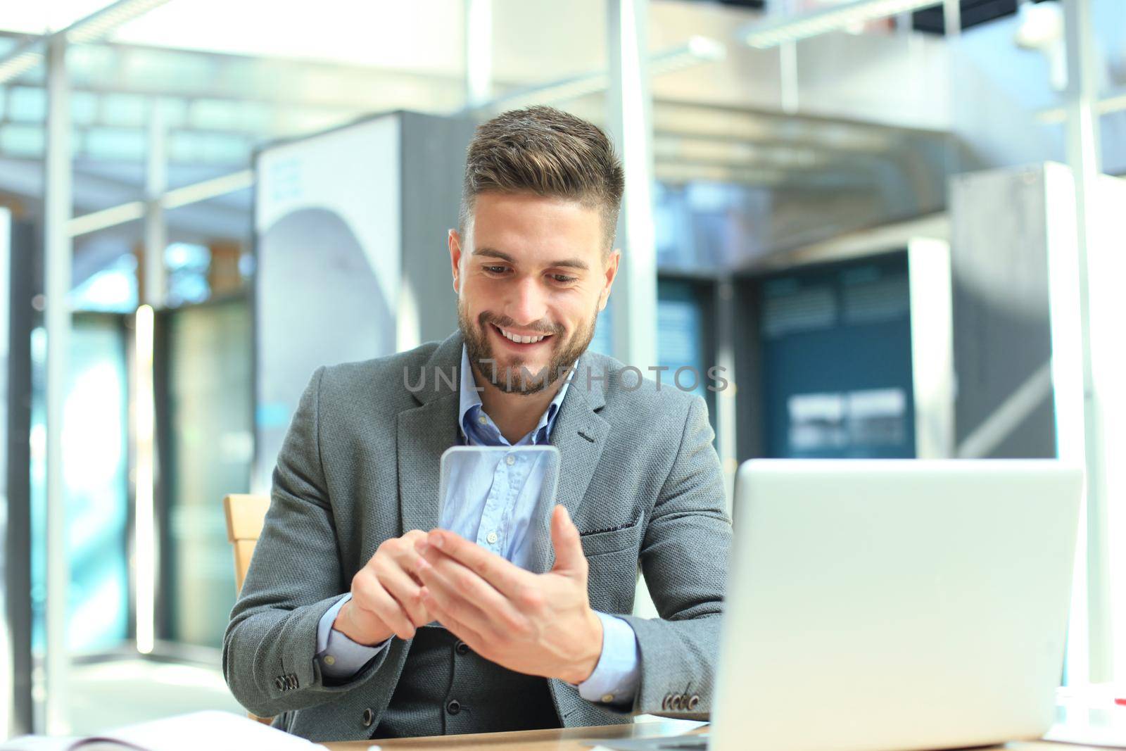 Future concept. Businessman holds futuristic transparent smart phone