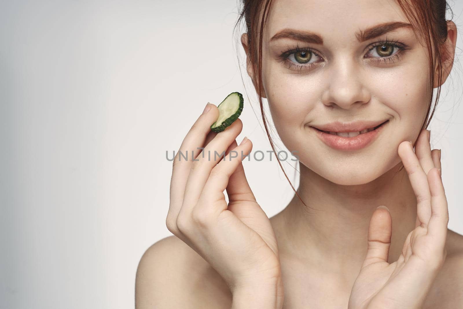 attractive woman with bare shoulders cucumber skin care health by Vichizh
