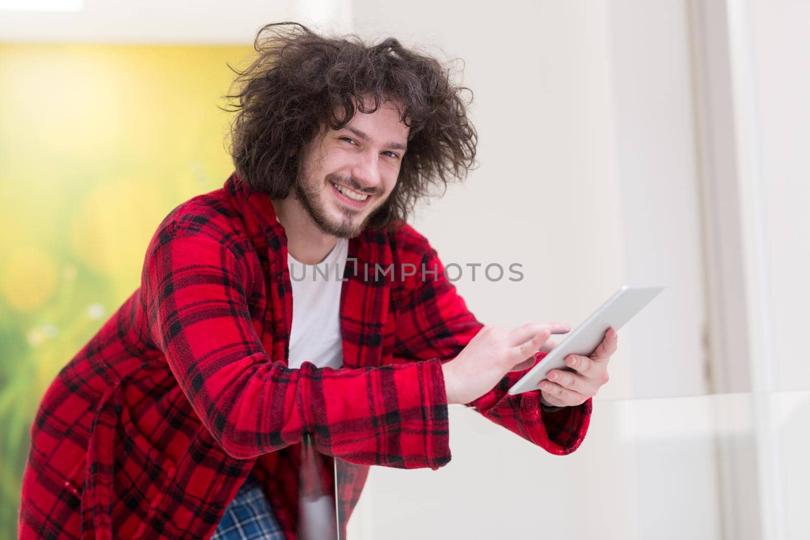 young freelancer using tablet computer by dotshock
