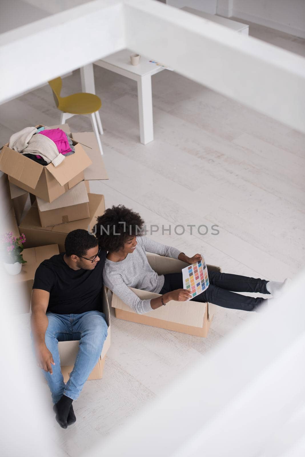 African American couple  playing with packing material by dotshock