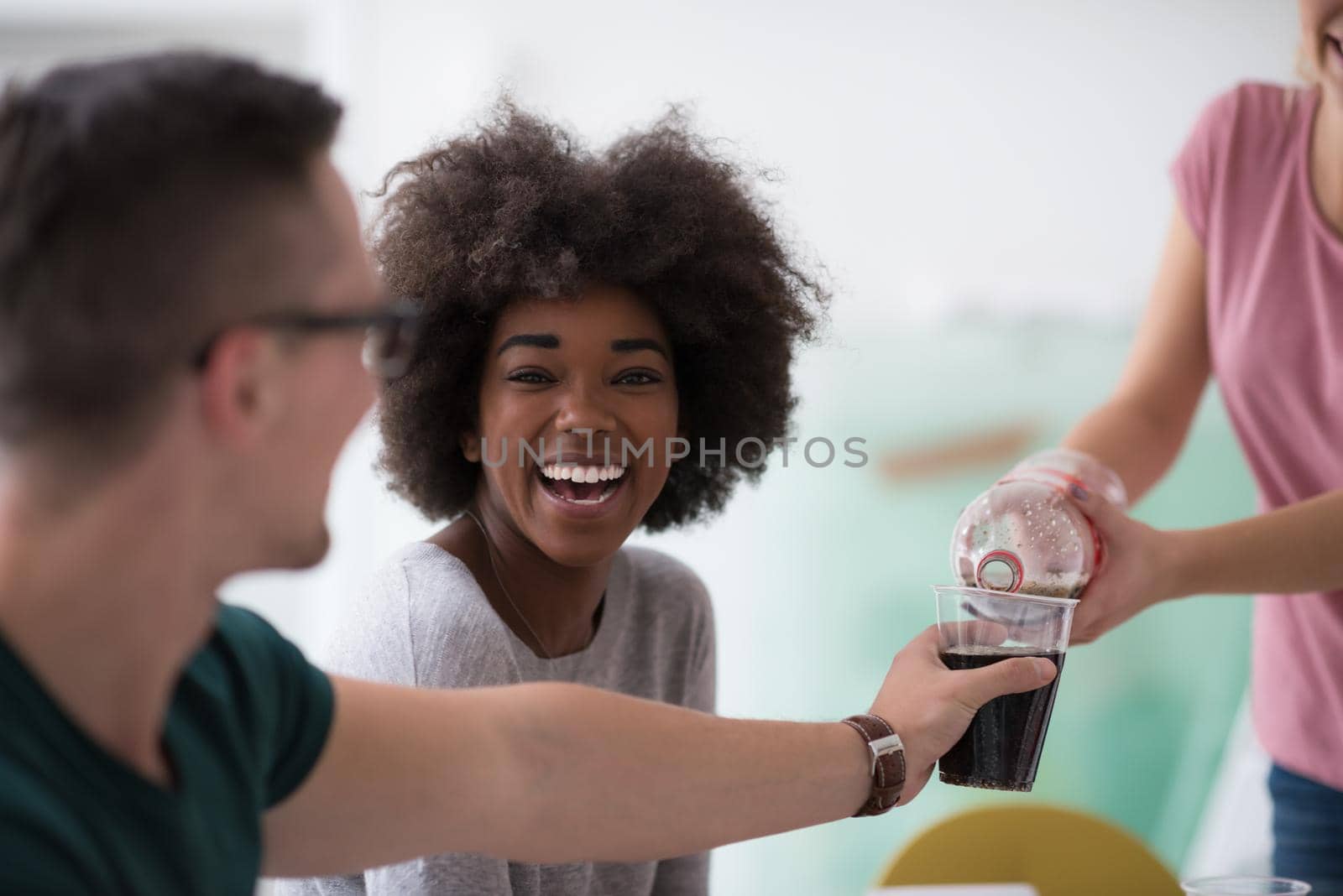 multiethnic group of young people have a lunch break by dotshock