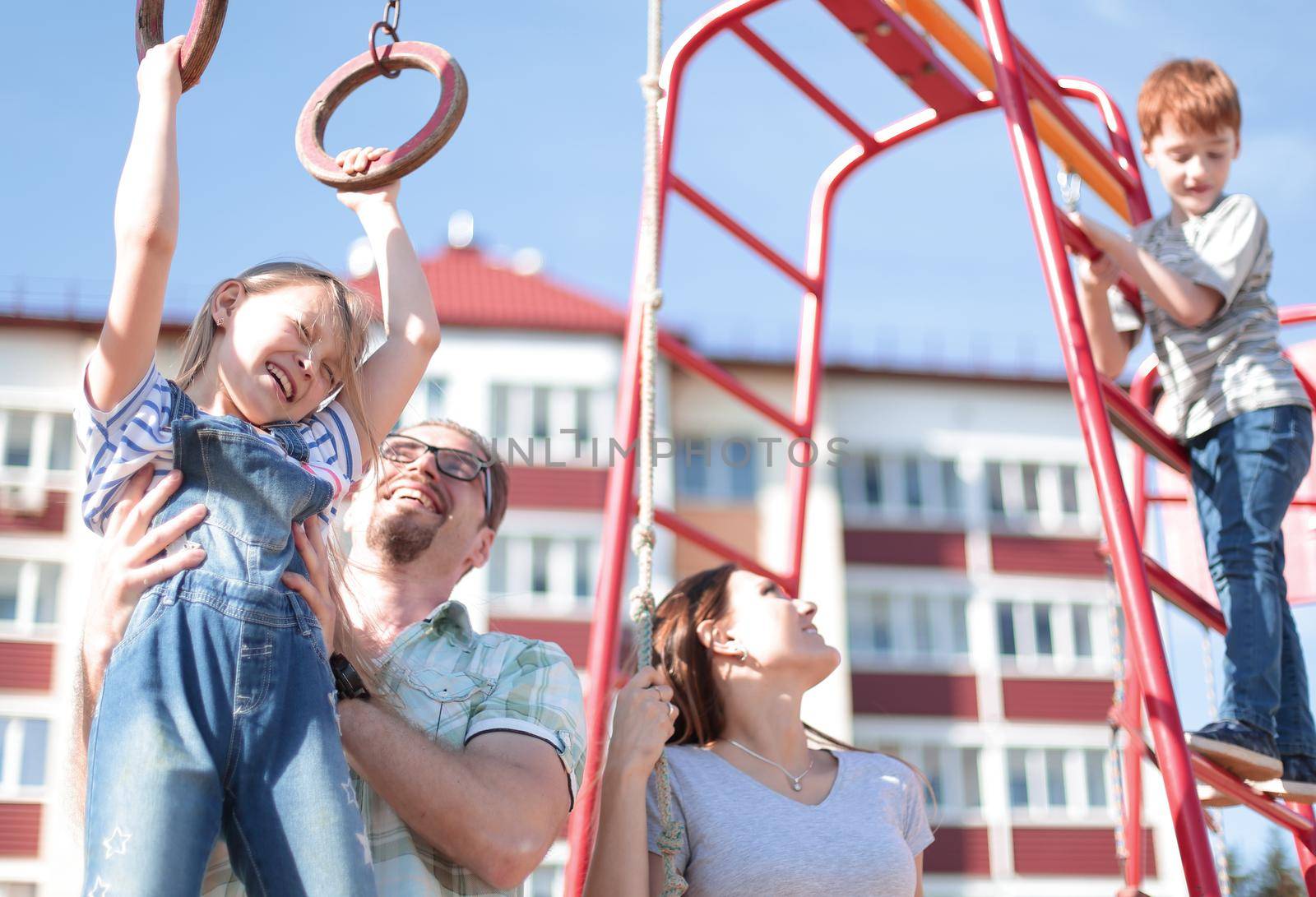 young family with children playing in the Playground.the concept of childhood and parenting