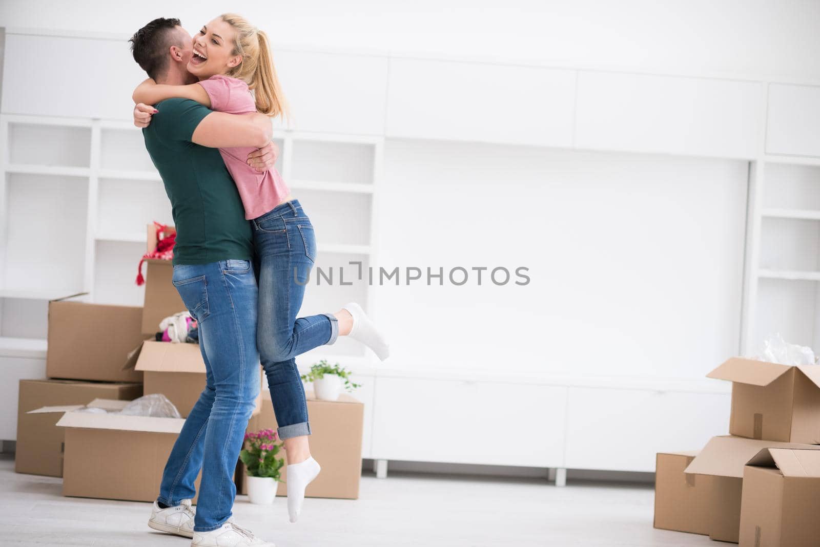 excited happy young couple looking forward to moving into a new home