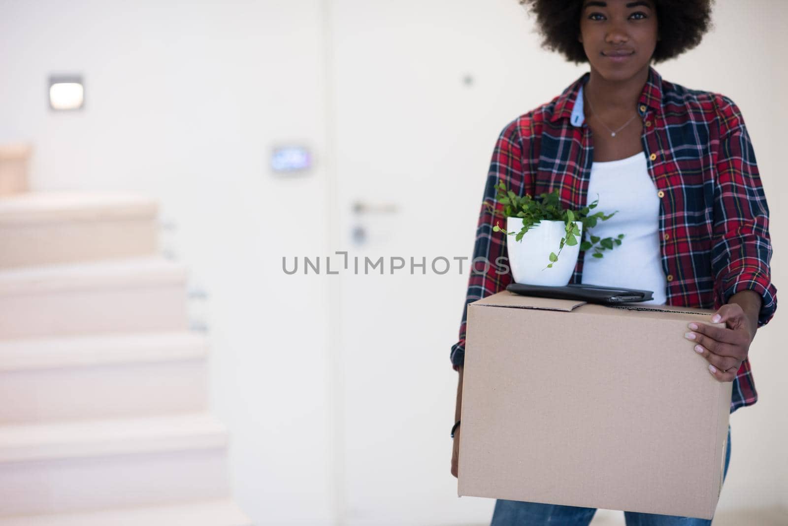 Black girl moving in the new apartment by dotshock