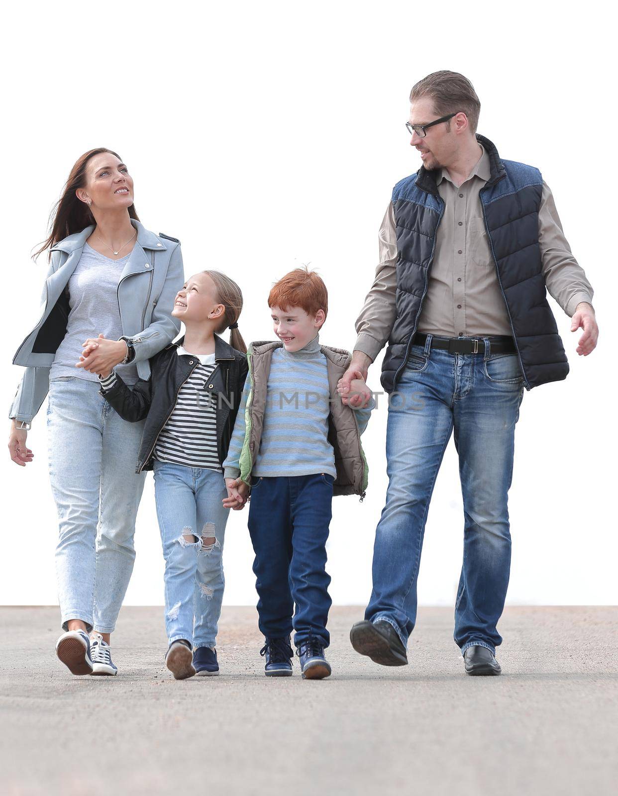 parents with their children walking along together.photo with copy space