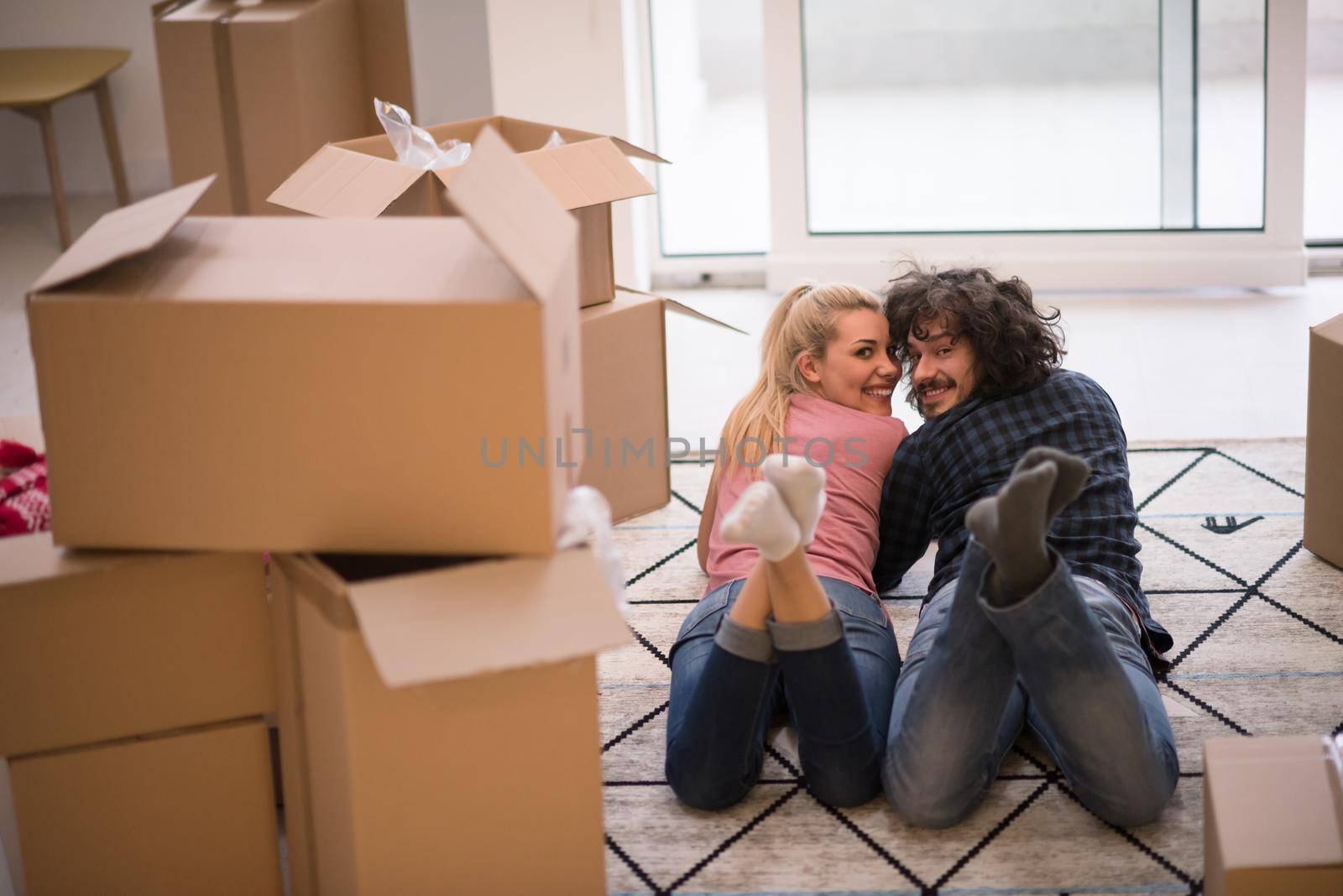 Young couple moving in a new flat by dotshock