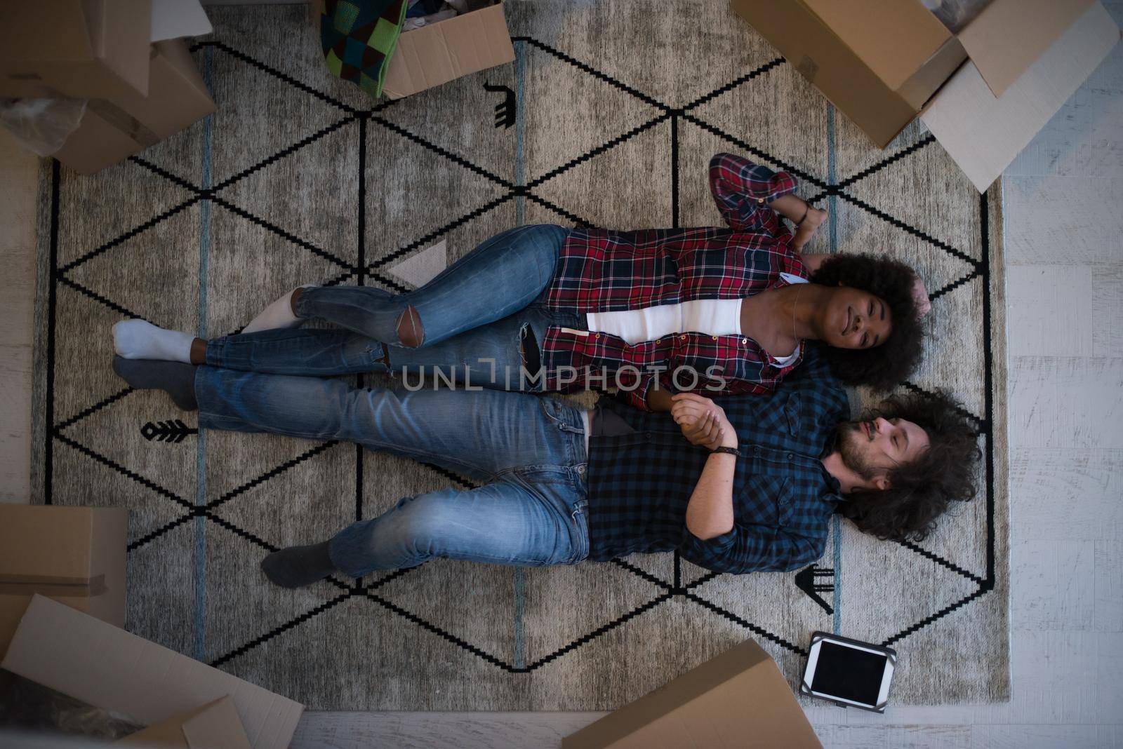 Top view of attractive young multiethnic couple by dotshock