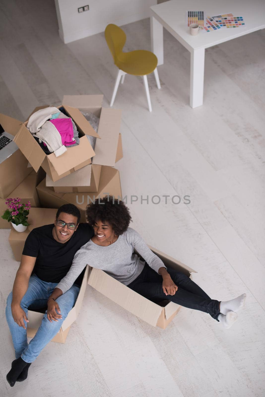 African American couple  playing with packing material by dotshock