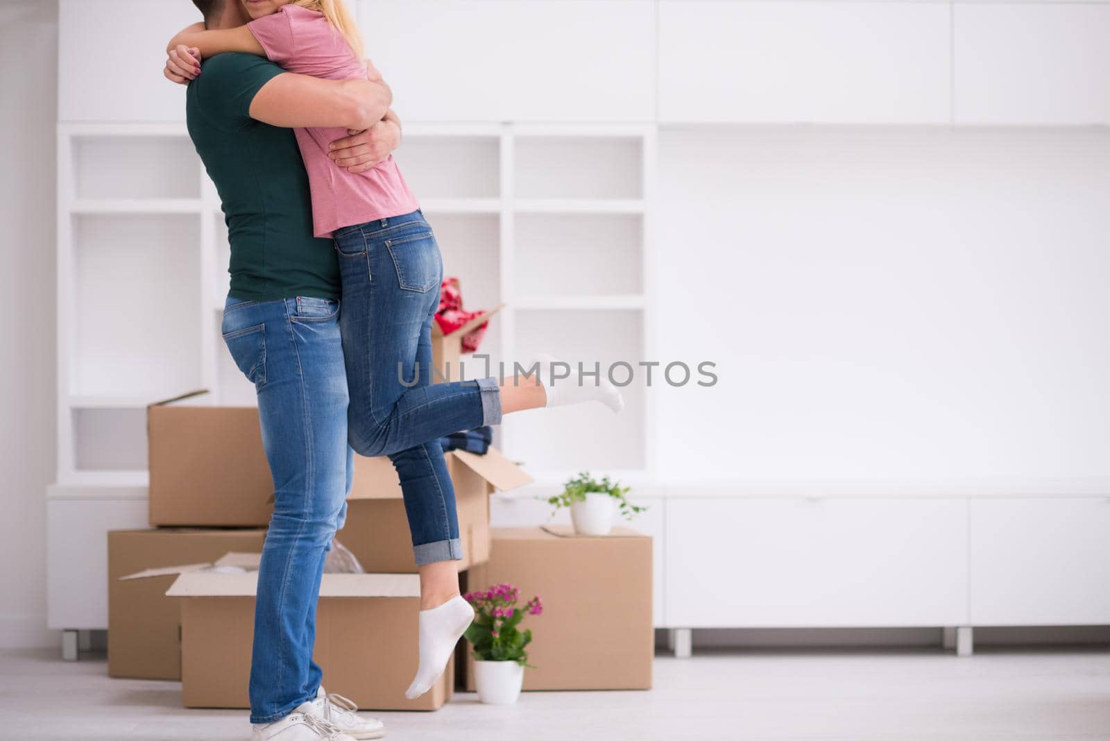 happy Young couple moving in new house by dotshock